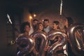 People at New Years party, waving with sparklers and holding 2020 balloons Royalty Free Stock Photo