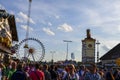 People next to the Paulaner tower at the Oktoberfest