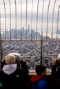 People looking New York skyline from The Empire State Building observation deck Royalty Free Stock Photo