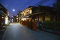 People offer food to Buddhist monks