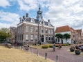 People and old town hall on Damplein square in Edam, Noord-Holland, Netherlands