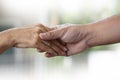 People old woman  and young hand holding Disabled walking with assistance Royalty Free Stock Photo