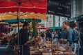 People at Olivers Bakery stall at Borough Market in London, UK