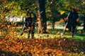 People operating a heavy duty leaf blower. Royalty Free Stock Photo