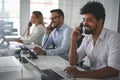 People in operations center talking on Landline phone. Operator Royalty Free Stock Photo