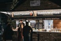 People order Dutch pancakes at a stall in Camden Market, London, UK, in evening