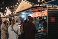 People order food from Steak & Chips stall at Southbank Centre Winter Market, London, UK