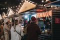 People order food from Steak & Chips stall at Southbank Centre Winter Market, London, UK