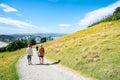 People outdoors taking morning walk up slope Mount Maunganui