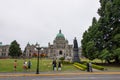 People outside the British Columbia Parliament Building in Victoria, Canada