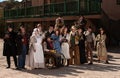 People outside a building in old west costumes Royalty Free Stock Photo