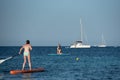 People in paddle surf in Es Pujols beach in Formentera, Spain in the summer of 2021 Royalty Free Stock Photo