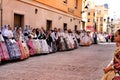 People parading in regional costumes in procession in Elche Royalty Free Stock Photo