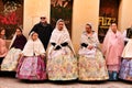 People parading in regional costumes in procession in Elche Royalty Free Stock Photo