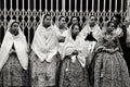 People parading in regional costumes in procession in Elche Royalty Free Stock Photo