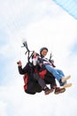 People, paragliding and smile in sky, together or extreme sport with freedom for fitness. Coach, partnership and person