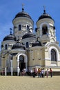People, parishioners near winter church of Holy Dormition Capriansky Monastery in Moldova. Monastery was founded in 1420. Concept
