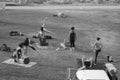 People in park by the beach doing yoga