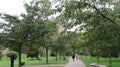 People on a Park Path with Blarney Castle in the Background