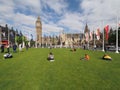 People in Parliament Square green in London