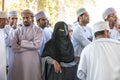 People participating in a goat auction on Nizwa market.