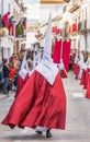 People participating in the Holy Week procession in a Spanish city during Easter