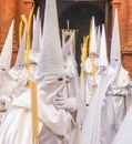 People participating in the Holy Week procession in a Spanish city during Easter