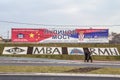 People passing by a billboard promoting Chinese investments in Serbia. China & Serbia relations are growing in economy & diplomacy