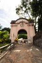 People passing through the entrance portal of Morro de Sao Paulo