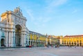 People are passing in front of the arco da rua augusta in Lisbon, Portugal