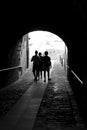 People passing through a narrow passage in Getaria