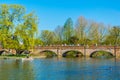 People are passing river Avon through a brick bridge in Stratford upon Avon, England