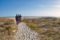 people on path dunes and Charleston beach