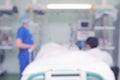 People at the patient bed, unfocused background