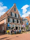 People on pavement cafe in historic old town of Dokkum, Friesland, Netherlands