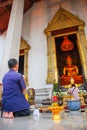 People pay homage, Wat Suthat Thepwararam, Beautiful temple architecture , Bangkok, Thailand