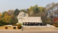 People pay respects in front of a communist monument in Pyongyang, North Korea