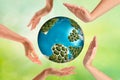 people, peace, love, life and environmental concept - close up of human hands showing heart shape gesture over earth globe and Royalty Free Stock Photo