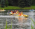 People In Peddle Boats On Small Lake Royalty Free Stock Photo