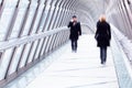 People on a pedestrian bridge