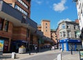 People in the pedestrian center of rochdale with the exchange shopping center on yorkshire street