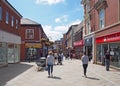 People in the pedestrian center of rochdale with the exchange shopping center on yorkshire street