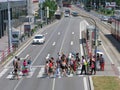 People on pedestrian crossing, locals and tourists