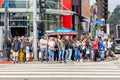 people at a pedestrian crossing wait for green light on Hollywood boulevard of Walk of Fame Royalty Free Stock Photo