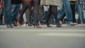 People pedestrians walks across a busy city street Royalty Free Stock Photo