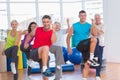 People performing aerobics exercise in gym class Royalty Free Stock Photo