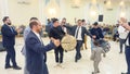 people performing dance with young drummer boy Arabian popular dance dabke