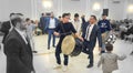 people performing dance with young drummer boy Arabian popular dance dabke