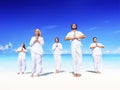 People performing yoga on the beach Peaceful Concept