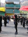 People performs JANJEERZANI at Julus of Imam Hussain a.s in Hunza valley. Market and Mountains in background